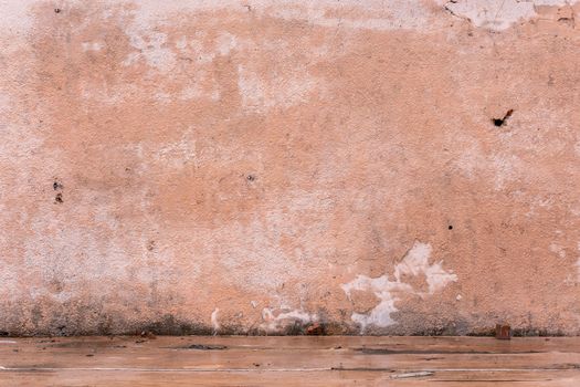 peach color wet plaster shabby wall texture and background.