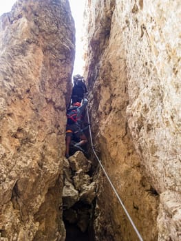 Climbing on the Rotwand and Masare via ferrata in the rose garden in the Dolomites, South Tyrol, Italy