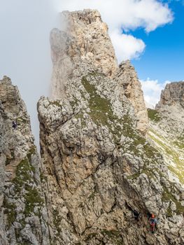 Climbing on the Rotwand and Masare via ferrata in the rose garden in the Dolomites, South Tyrol, Italy