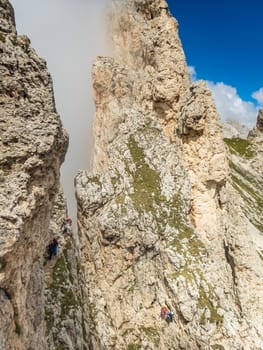 Climbing on the Rotwand and Masare via ferrata in the rose garden in the Dolomites, South Tyrol, Italy