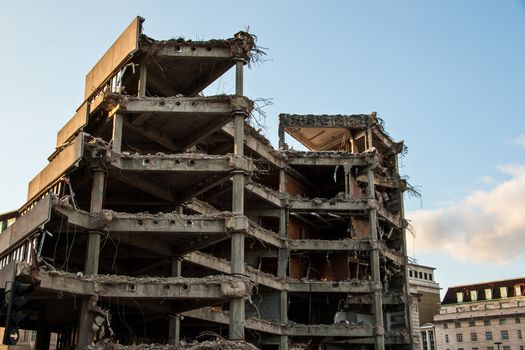 Remains of demolished modern building showing concrete floors