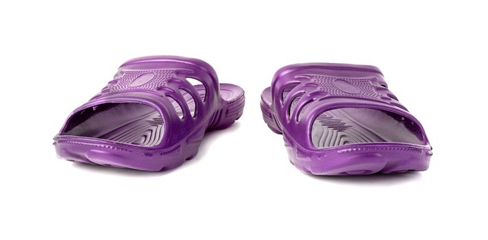 a pair of cheap durable purple rubber slippers isolated on white background.