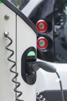 Electric car charging station at street level in Singapore, Southeast Asia.