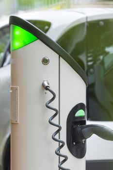 Electric car charging station at street level in Singapore, Southeast Asia.