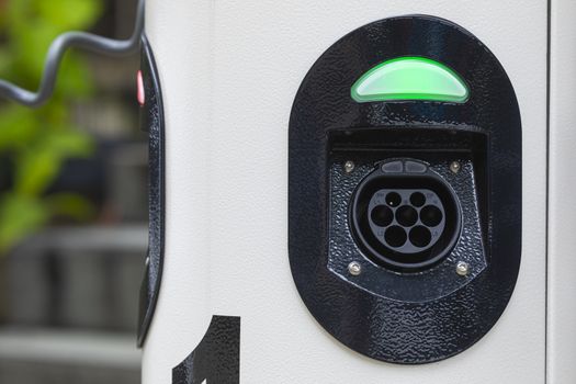 Electric car charging station at street level in Singapore, Southeast Asia.