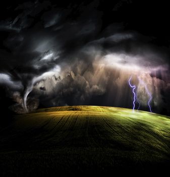 Tornado in stormy landscape