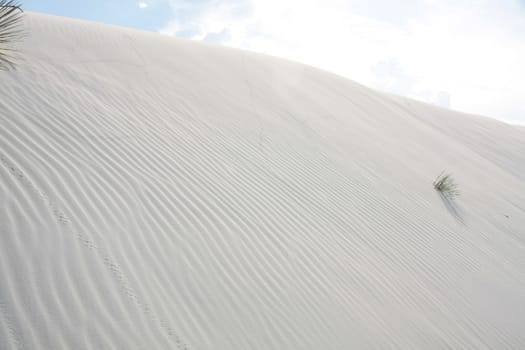 Clouds over surreal white desert