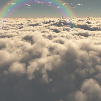 Rainbow above cumulus clouds.