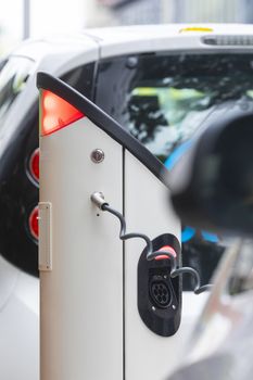 Electric car charging station at street level in Singapore, Southeast Asia.