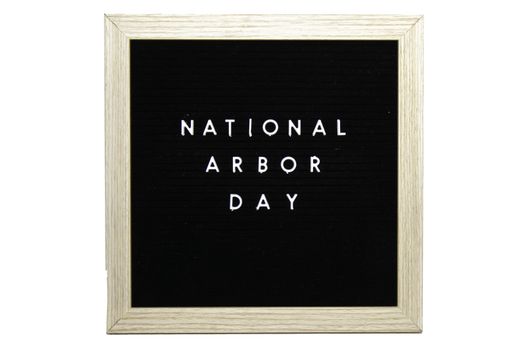 A Black Sign With a Birch Frame That Says National Arbor Day in White Letters on a Pure White Background