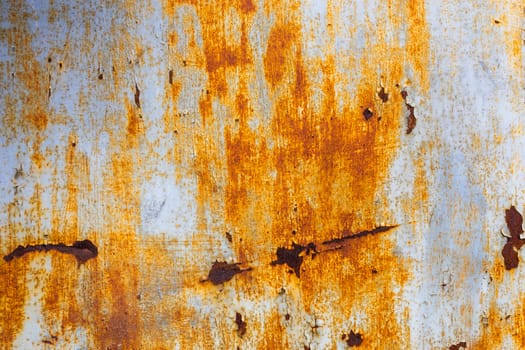 abstract background and texture of white steel surface with orange rust stains.