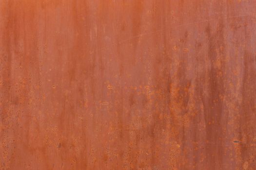 flat matte brown painted steel surface with light rust spots and minor scratches
