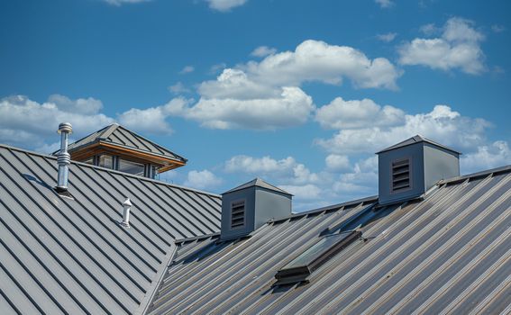 Ribbed Metal Roof Under Blue Skies