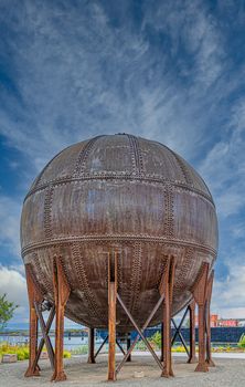 Round Rusty Tank with Rivets on Coast