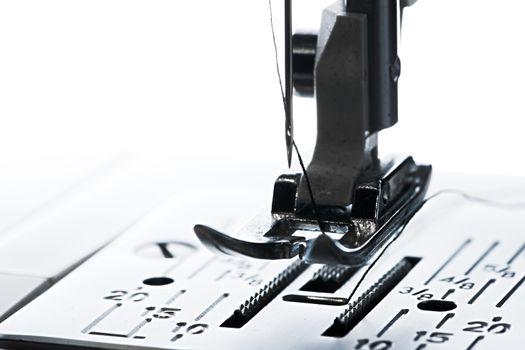 6 - Pure white plain background, dark silhouette of ready to go sewing machine, leading left to right with copy space.