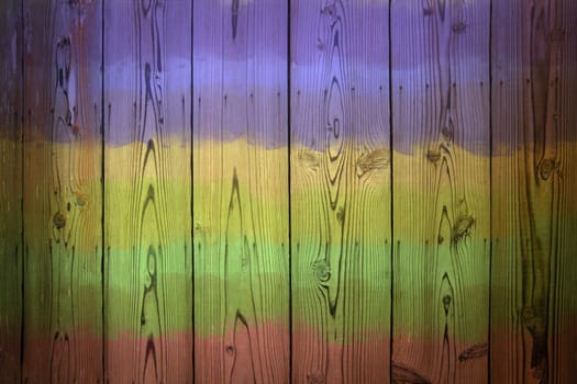 Multi difference colors on wooden wall for background.