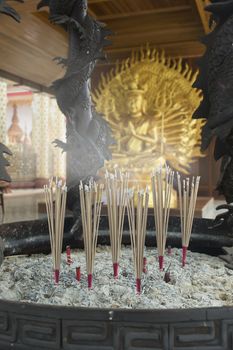 Asian culture blessed the goddess Guan Yin with the incense in the altar.