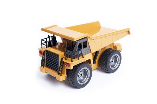 Toy model of heavy truck for mining on white background.