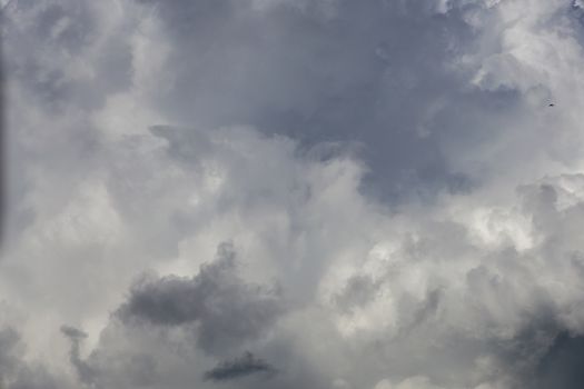 gray incoming storm clouds closeup backdrop, captured with telephoto lens