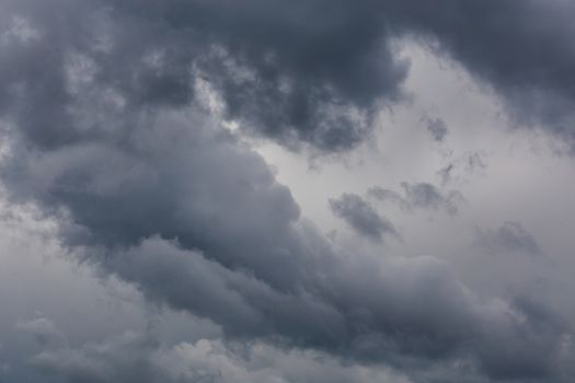 gray incoming storm clouds closeup backdrop, captured with telephoto lens