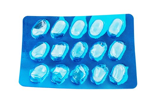 empty blue pills blister isolated on white background, used pack of tablets