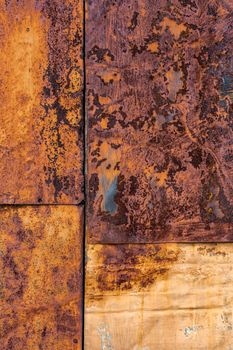 Several nailed rusted iron sheets flat background and texture