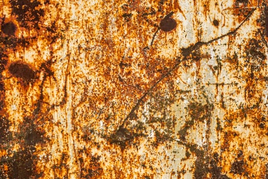 rusted flat solid sheet metal background and texture with leftovers of white paint.