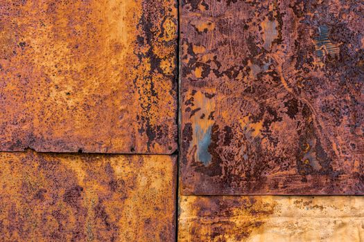 Several nailed rusted iron sheets flat background and texture