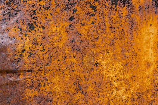 rusted flat solid sheet metal background and texture with leftovers of white paint.