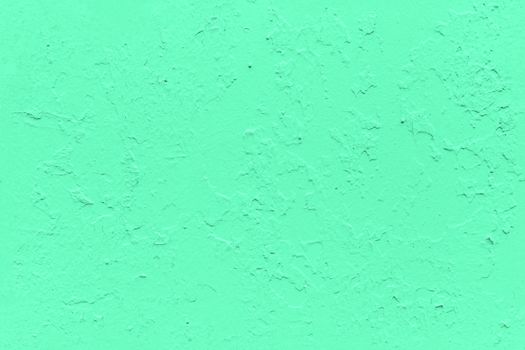 seamless texture of flat thick painted aqua menthe color surface under direct sunlight - new paint over fragments of old peeled one