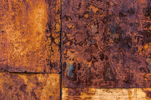 Several nailed rusted iron sheets flat background and texture