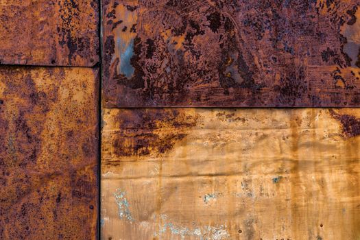 Several nailed rusted iron sheets flat background and texture