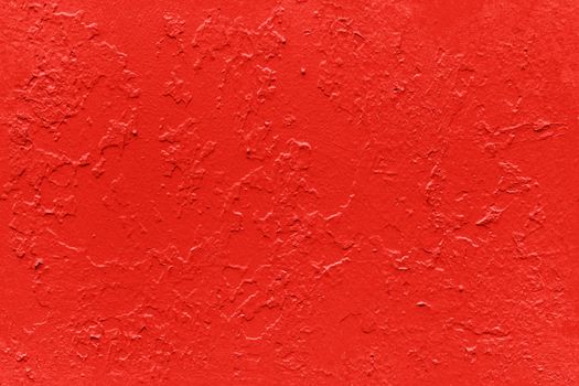 seamless texture of flat thick red maple color painted yellow surface under direct sunlight - new paint over fragments of old peeled one