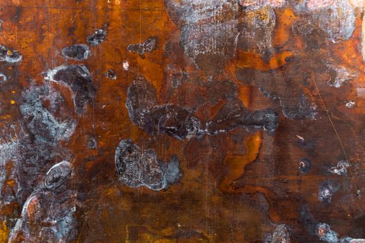 texture of old oxidated sheet of brass with colorful spots and some minor scratches.