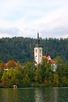 Beautiful view of Lake Bled with the Pilgrimage Church of the Assumption of Maria on a small island and Bled Castle