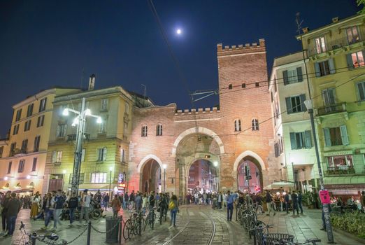 MILAN, ITALY - SEPTEMBER 2015: Tourists and locals enjoy night life near Medieval Porta Ticinese.