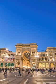 MILAN, ITALY - SEPTEMBER 2015: Tourists and locals enjoy night life in Duomo Square, city tourist center