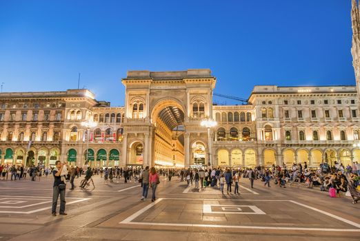 MILAN, ITALY - SEPTEMBER 2015: Tourists and locals enjoy night life in Duomo Square, city tourist center