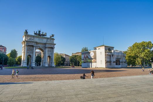 MILANO, ITALY - SEPTEMBER 2015: Tourists visit Arco della pace in the gardens of Parco Sempione.