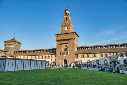 MILAN, ITALY - SEPTEMBER 2015: Tourists visit Sforza Castle and Park in summer season.