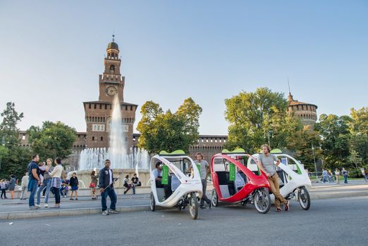 MILAN, ITALY - SEPTEMBER 2015: Tourists visit Sforza Castle and Park in summer season.