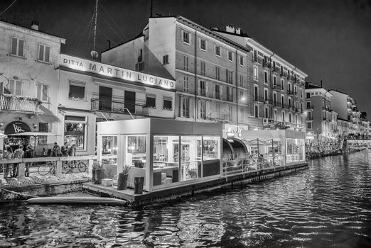 MILANO, ITALY - SEPTEMBER 2015: Tourists and locals enjoy night life along Navigli.