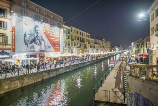 MILANO, ITALY - SEPTEMBER 2015: Tourists and locals enjoy night life along Navigli.
