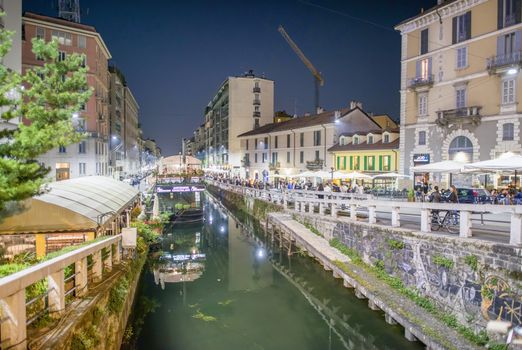 MILANO, ITALY - SEPTEMBER 2015: Tourists and locals enjoy night life along Navigli.