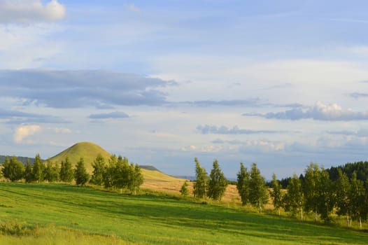 summer landscape with mountain and blue sky with clouds