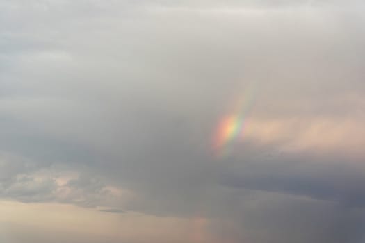 Beautiful eveing sky with clouds and rainbow, air nature