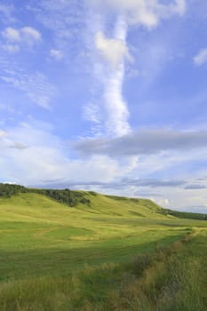 summer landscape with mountain and blue sky with clouds