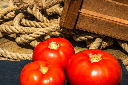 Close up of fresh ripe tomatoes isolated in a rustic composition,