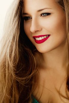 Charming woman smiling, brunette with long light brown hair, girl wearing natural makeup look, female showing healthy white teeth, beauty portrait for cosmetic or lifestyle brands