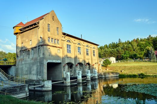 the river and the building of a historic hydroelectric power plant in Bledzew in Poland